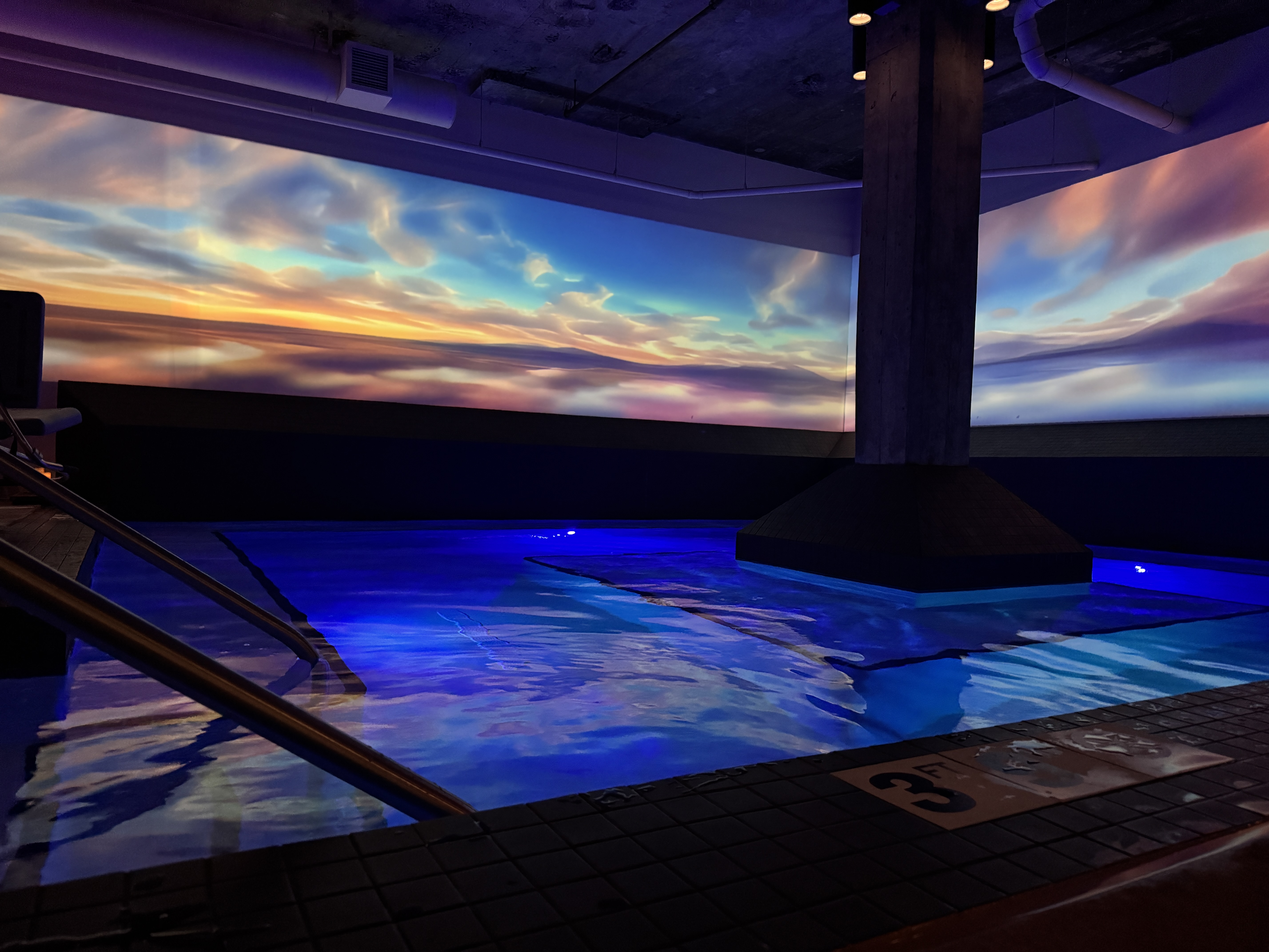 Sunset cloudscape projected across spa walls